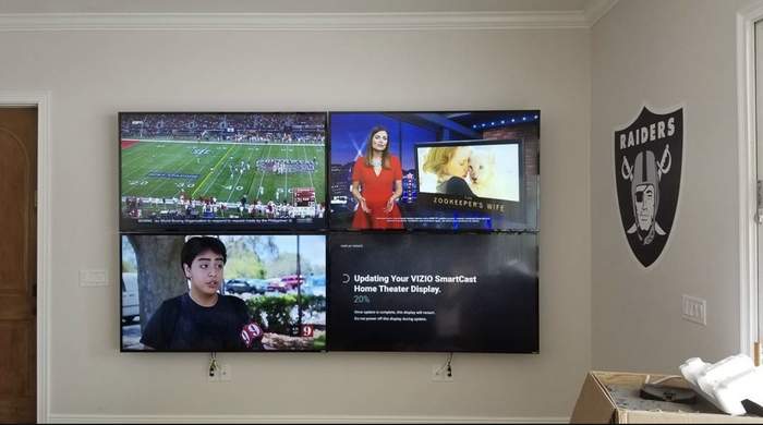 Four mounted TVs in a video wall layout