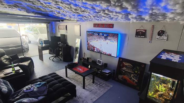 Mounted TV in a finished garage media room